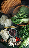 Ingredients for Asian cuisine in a bamboo steamer