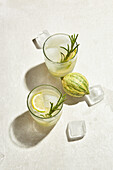 Homemade lemonade with tiger lemon ginger syrup, rosemary and ice cubes