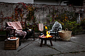Fire pit and seating on autumnal terrace