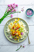 Curried trout on creamy mango and white cabbage salad and rice
