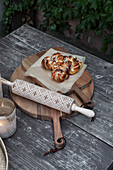 Cutting boards, rolling pin, and cinnamon rolls