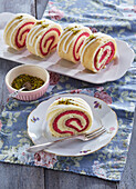 Sponge cake roll with punch and pistachios