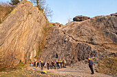 Group cilmbing on Dinas Rock, Pontneddfechan, Wales