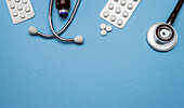 Stethoscope and pill tablets