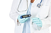 Doctor holding diabetic supplies