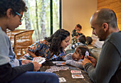 Family playing card game at home