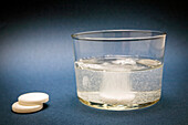 Effervescent tablet into glass of water