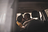Couple kissing in car