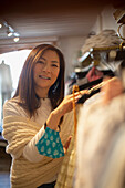 Woman with face mask in clothing shop