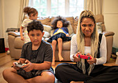 Competitive mother and son playing video game