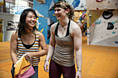 Happy women friends at climbing center