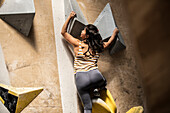 Woman climbing rock wall