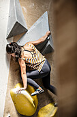 Woman on climbing wall