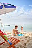 Couple relaxing and playing in ocean