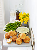 Mini smoked haddock Scotch eggs with asparagus dippers and watercress mayonnaise