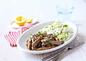 Sliced beef meat with kohlrabi salad and rice