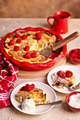 Casserole of pancakes with vanilla cottage cheese and raspberries