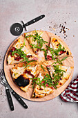 Pizza Bianca with gorgonzola, pears, walnuts, ham, and rocket salad