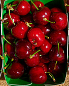 Fresh cherries in a cardboard box (close-up)