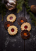 Spitzbuben with strawberry jam and Spitzbuben with apricot jam and chocolate icing