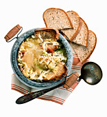 Zuppa Valpellinese (Italian cabbage soup topped with bread and cheese)