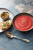 Mustard soup with beetroot served with bread with hemp butter