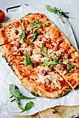Pizza with rocket, salsiccia and mozzarella cheese