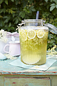 Elderflower cordial in a large glass jar