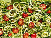 Zucchini noodles (zoodles) with cherry tomatoes (picture-filling)