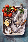 Gilthead, tomatoes, lemon, sea salt and peppercorns