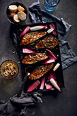 Grilled teriyaki aubergines with red chicory and tomatoes