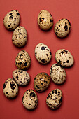 Quail eggs on a rusty brown background