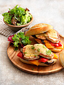 Raclette baguette with pork steaks and vegetables