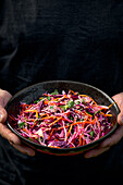 Summer red and white cabbage slaw with carrots, coriander, lime juice and sesame seeds