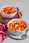 Soup with chicken, white beans, carrots, peppers, and potatoes