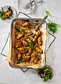 Chicken wings with wild garlic in a casserole dish