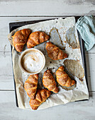 Pretzel croissants made from puff pastry and yeast dough
