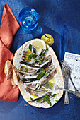Alici marinate – marinated anchovies with lemons and mint (Sicily, Italy)