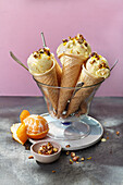 Ricotta and clementine ice cream with nuts
