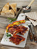 Grilled pork ribs with stuffed pointed peppers