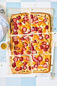 Puff pastry tart with cottage cheese, strawberries, apricots, thyme and honey