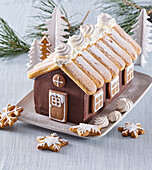 Gingerbread house with a roof of ladyfingers