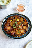 Tarte Tatin of roasted red onions and garlic served with herb labneh