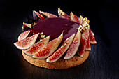 Red wine and fig cake with gold leaf