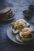 Sandwiches with poached egg, avocado and smoked salmon