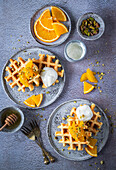 Waffles with orange, yogurt and pistachios