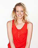 A young blonde woman wearing a red top