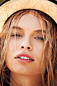 Young woman wearing a sunhat