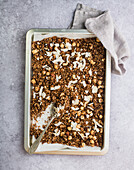 Homemade granola muesli with nuts on an oven tray