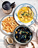 Mussels in mustard sauce, chips, and Belgian cod soup